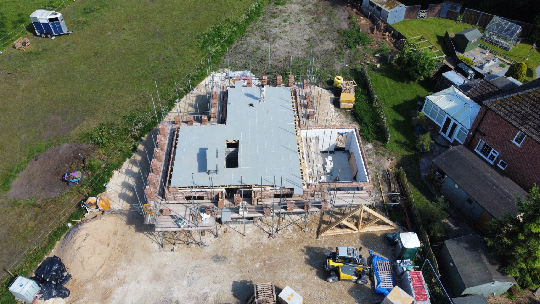 Engineered first floor joists installed and decked with stair opening trimmed.
