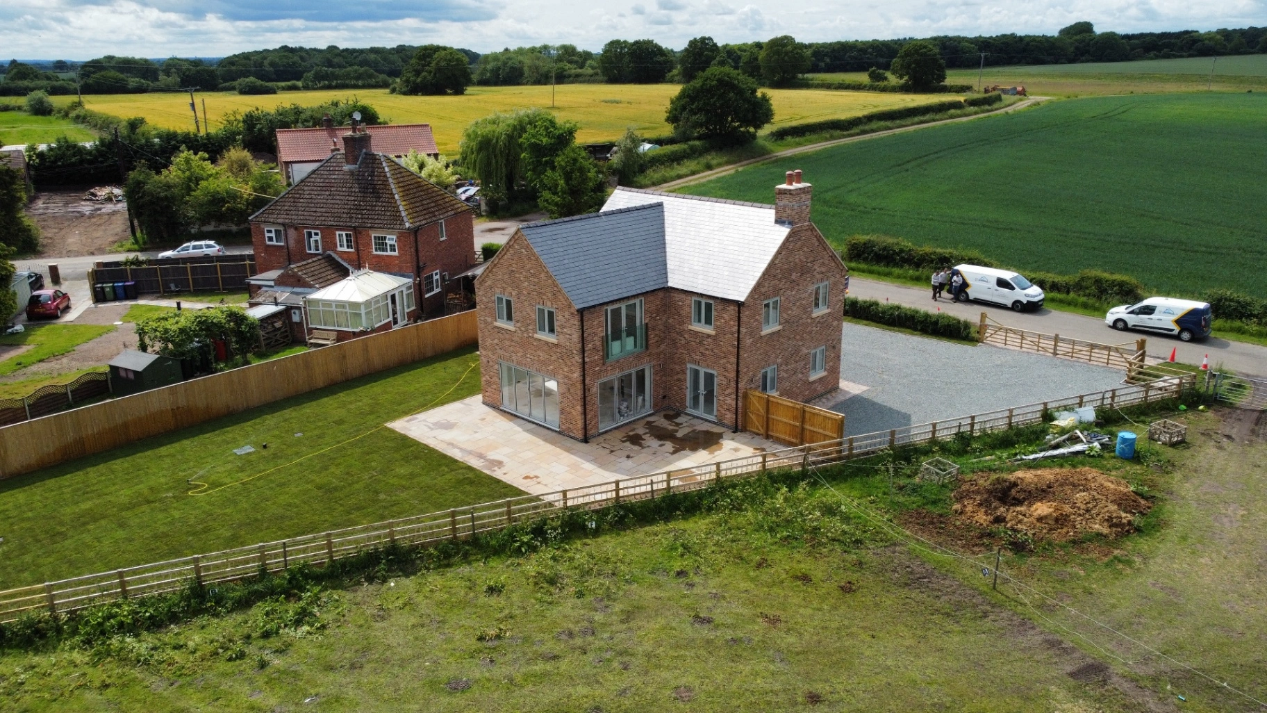 Front elevation of new build home in Legsby with white framed windows.