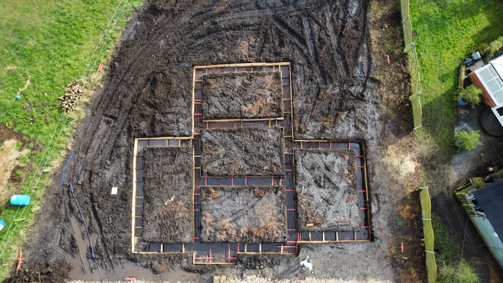 Drone view of strip foundations set out for external and internal walls.