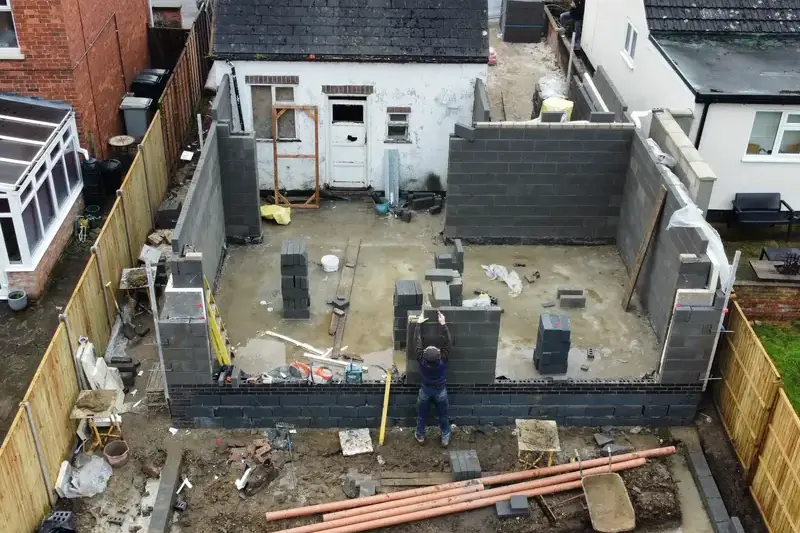 Rear view of Eastfield Road extension showing wide openings for doors and windows.