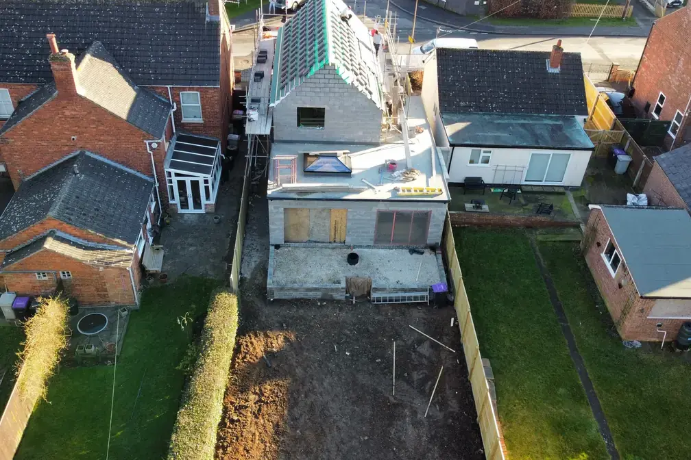 Garden view of the completed Eastfield Road extension connecting indoor and outdoor space.