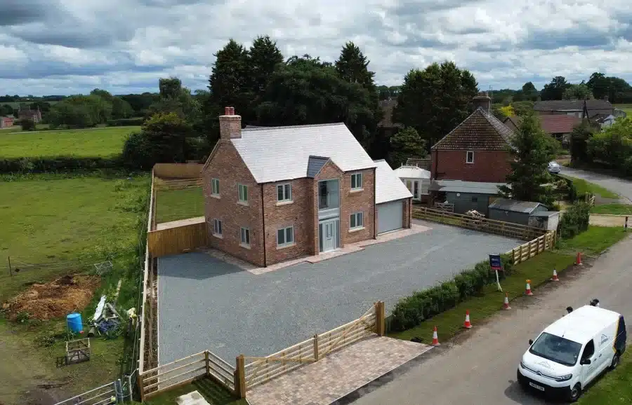 New detached house with front garden.