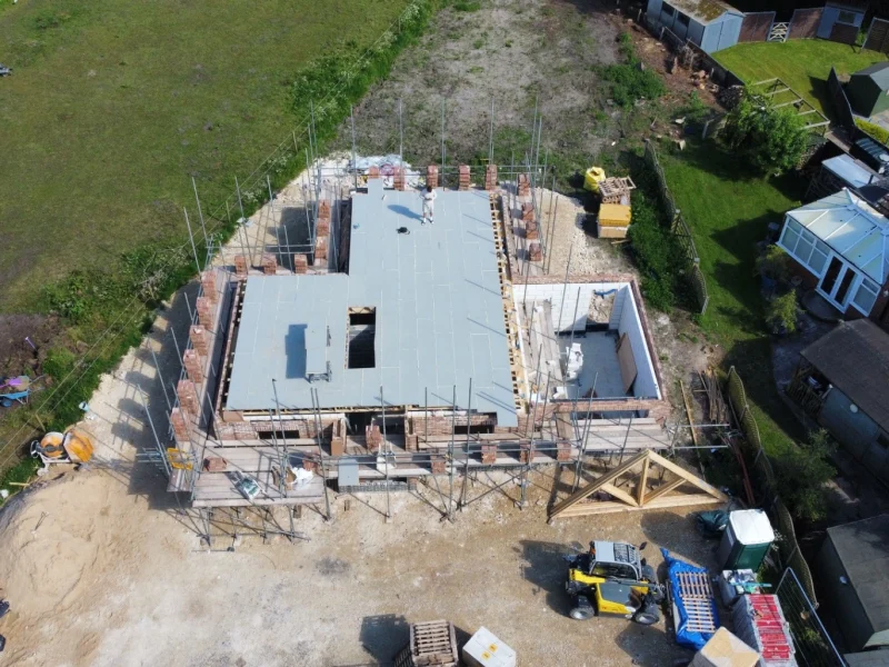 engineered first floor joists installed and decked with stair opening trimmed.